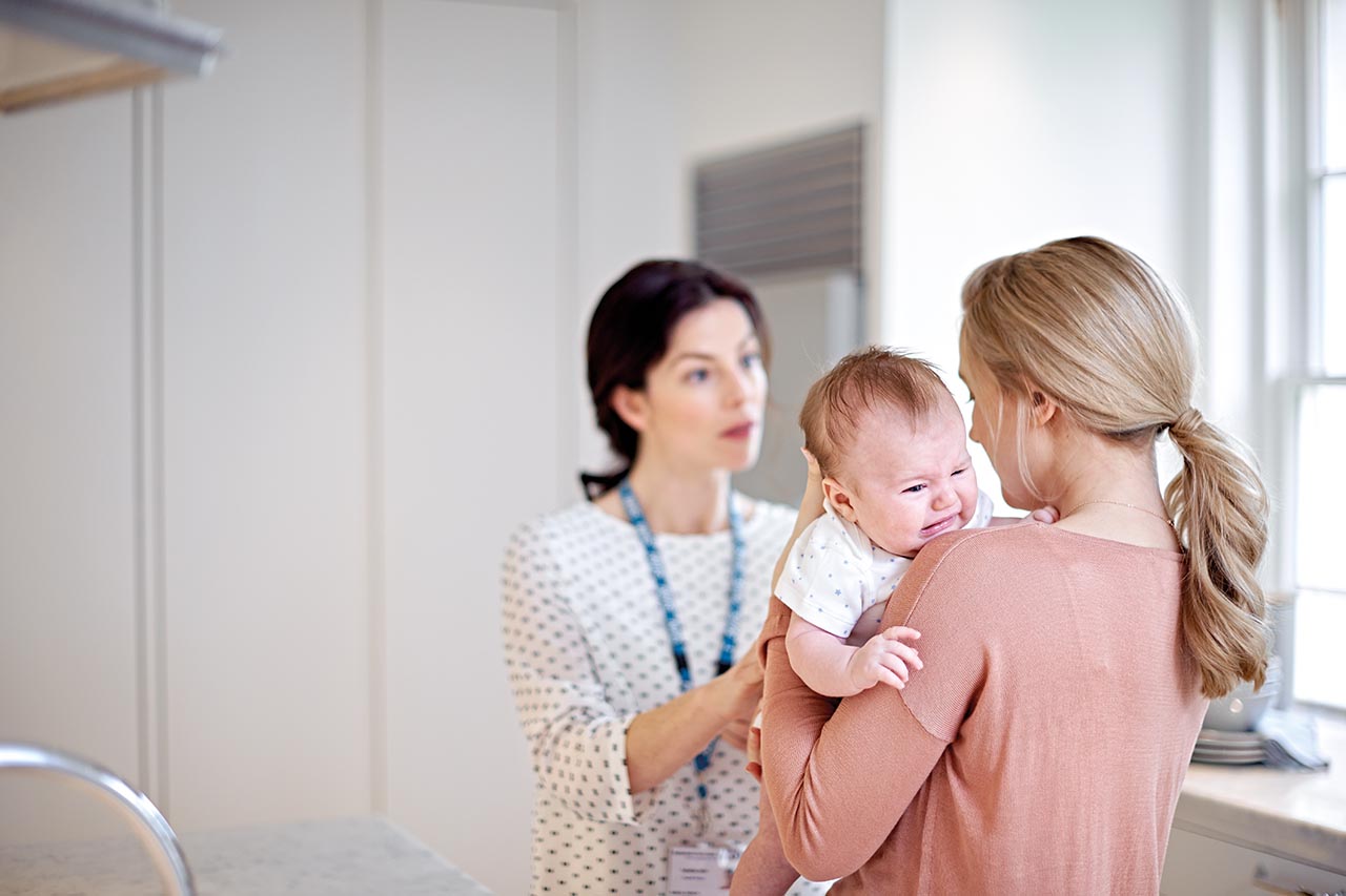 Baby with colic at a GP appointment